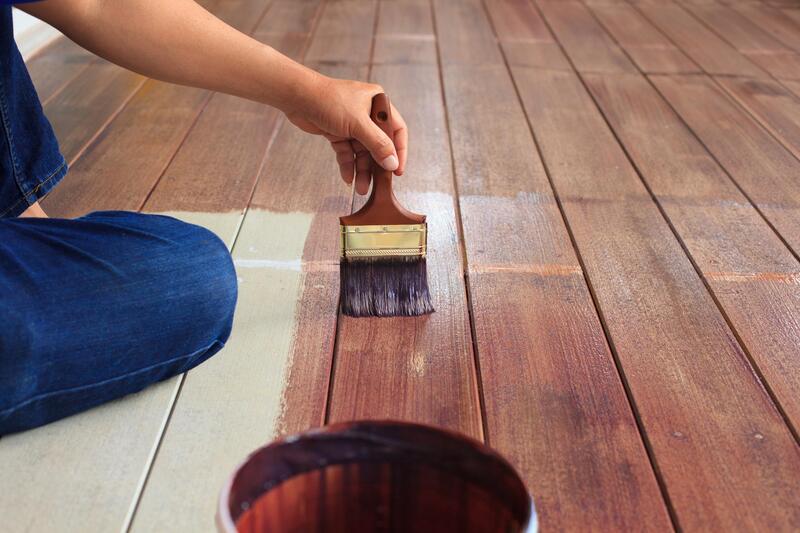 painter painting the wood floor